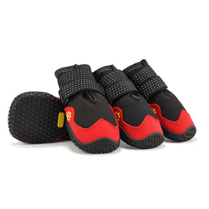Set of four black and red dog boots with non-slip rubber soles and reflective Velcro straps.