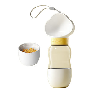 Portable dog water bottle with attached bowl and detachable food container, featuring a yellow lock and wrist strap.